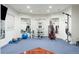 Home gym features mirrors, weight machines, and rubber flooring for a complete workout experience at 6616 E Prentice Ave, Greenwood Village, CO 80111