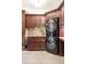 Functional laundry room with modern stacked washer and dryer at 6616 E Prentice Ave, Greenwood Village, CO 80111