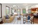 Bright living room with hardwood floors, stylish furnishings, and abundant natural light at 6616 E Prentice Ave, Greenwood Village, CO 80111