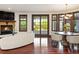 Bright living room with a fireplace, large windows, and a sliding door leading to the outdoor space at 6616 E Prentice Ave, Greenwood Village, CO 80111