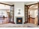Sitting room with a fireplace and direct access to other areas of the home at 6616 E Prentice Ave, Greenwood Village, CO 80111