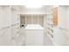Large walk-in closet featuring built-in shelving, drawers, and a personal safe at 6616 E Prentice Ave, Greenwood Village, CO 80111