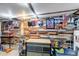 Unique basement featuring wood paneling, custom decor, and workshop area at 3151 N Elizabeth St, Denver, CO 80205