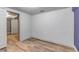 Finished basement area leading to a room with an unfinished look at 3151 N Elizabeth St, Denver, CO 80205