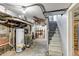 Unfinished basement featuring utilities, storage and access to the upper levels of the home at 3151 N Elizabeth St, Denver, CO 80205