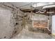 Unfinished basement with exposed foundation wall and utilities at 3151 N Elizabeth St, Denver, CO 80205