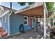 Exterior shot showing address, red door, and covered patio with a barbecue grill at 3151 N Elizabeth St, Denver, CO 80205