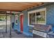 Exterior shot showing address, red door, and covered patio with a barbecue grill at 3151 N Elizabeth St, Denver, CO 80205