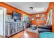 Inviting living room with hardwood floors, decorative furniture, and modern entertainment center at 3151 N Elizabeth St, Denver, CO 80205