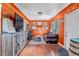 Inviting living room with hardwood floors, orange walls, and stylish furniture at 3151 N Elizabeth St, Denver, CO 80205