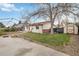 Spacious backyard featuring open space, a patio, a shed, and mature trees at 9698 Pecos St, Thornton, CO 80260