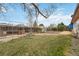 Expansive backyard featuring open space, lush grass, garden beds, and fencing at 9698 Pecos St, Thornton, CO 80260