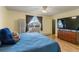 Comfortable bedroom features a bed with navy-blue bedding and coordinated decor at 9698 Pecos St, Thornton, CO 80260