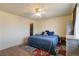 Comfortable bedroom features hardwood floors, a ceiling fan, and a warm rug at 9698 Pecos St, Thornton, CO 80260