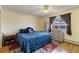 Comfortable bedroom with a queen bed, a ceiling fan, and a window with curtains at 9698 Pecos St, Thornton, CO 80260