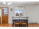Cozy dining area with a table set for four, a window view, and wood-look flooring at 9698 Pecos St, Thornton, CO 80260