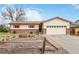 Charming ranch-style home featuring a brick facade, well-kept lawn, and inviting curb appeal at 9698 Pecos St, Thornton, CO 80260