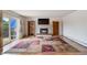 Living room features a fireplace, wood floors, and a sliding glass door at 9698 Pecos St, Thornton, CO 80260