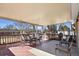 A covered outdoor patio with an open view of the neighborhood at 1300 Kennedy Dr, Northglenn, CO 80234