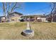 The backyard includes a brick patio and a large yard space at 1300 Kennedy Dr, Northglenn, CO 80234
