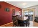Elegant dining room featuring stylish decor, a modern light fixture and sliding door at 1300 Kennedy Dr, Northglenn, CO 80234