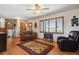 Inviting living room with hardwood floors, a ceiling fan, and lots of natural light at 1300 Kennedy Dr, Northglenn, CO 80234