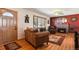 Comfortable living room featuring hardwood floors, a fireplace, and plenty of natural light at 1300 Kennedy Dr, Northglenn, CO 80234