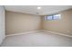 Unfinished basement room with a window and neutral walls at 5222 S Emporia Way, Greenwood Village, CO 80111