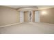 Unfinished basement with neutral carpeting and plenty of space at 5222 S Emporia Way, Greenwood Village, CO 80111