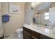 Clean bathroom with a vanity, toilet, and shower/tub at 5222 S Emporia Way, Greenwood Village, CO 80111