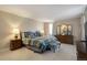 Comfortable bedroom with a dresser and nightstands at 5222 S Emporia Way, Greenwood Village, CO 80111