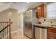 Modern kitchen with stainless steel refrigerator and granite countertops at 5222 S Emporia Way, Greenwood Village, CO 80111