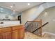 View of kitchen island and staircase leading to upper level at 5222 S Emporia Way, Greenwood Village, CO 80111