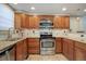 Spacious kitchen featuring stainless steel appliances and granite countertops at 5222 S Emporia Way, Greenwood Village, CO 80111