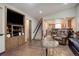 Living area showcasing hardwood floors and built-in entertainment center at 5222 S Emporia Way, Greenwood Village, CO 80111