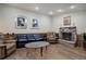 Living room features hardwood floors and a stone fireplace at 5222 S Emporia Way, Greenwood Village, CO 80111