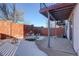 Private patio with seating area, brick wall, and partial snow cover at 5222 S Emporia Way, Greenwood Village, CO 80111