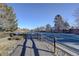 Residential street view with trees and walking path at 5222 S Emporia Way, Greenwood Village, CO 80111