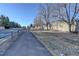 Residential street view with trees and walking path at 5222 S Emporia Way, Greenwood Village, CO 80111