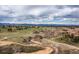 Wide aerial shot of the greenbelt with trails and mountain views at 9450 Sori Ln, Highlands Ranch, CO 80126