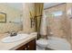 A full bathroom features a tub and shower and vanity with a sink at 9450 Sori Ln, Highlands Ranch, CO 80126