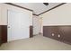 The bedroom features wainscoting and a closet at 9450 Sori Ln, Highlands Ranch, CO 80126