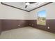 The bedroom features wainscoting and a window that provides natural light and views of the yard at 9450 Sori Ln, Highlands Ranch, CO 80126