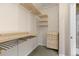 A walk in closet offers shelving and storage for clothes and accessories at 9450 Sori Ln, Highlands Ranch, CO 80126