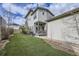 Spacious backyard with artificial grass and a patio area at 1558 White Violet Way, Louisville, CO 80027
