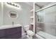 Modern bathroom featuring glass-enclosed shower, sleek vanity with undermount sink, and contemporary lighting at 1558 White Violet Way, Louisville, CO 80027