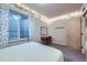 Bedroom featuring a decorative mirror, vanity, bench and overhead string lights at 1558 White Violet Way, Louisville, CO 80027
