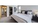 Comfortable bedroom with a modern closet with an open doorway to another room at 1558 White Violet Way, Louisville, CO 80027