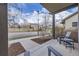 Inviting covered front porch with stylish seating, offering a relaxing outdoor space in a residential neighborhood at 1558 White Violet Way, Louisville, CO 80027