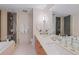 Elegant bathroom with double vanity, tiled shower, and ample space for personal care at 1620 Little Raven St # 103, Denver, CO 80202